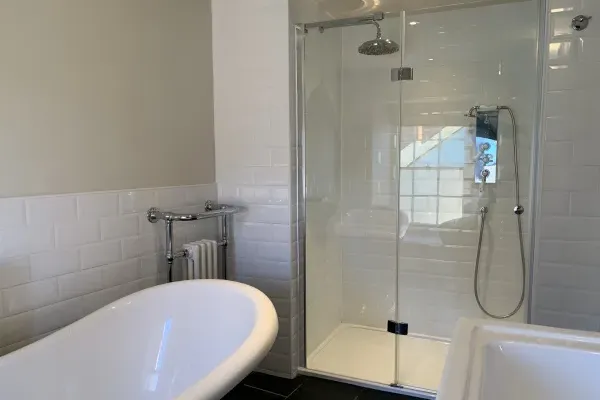 Four en-suite bathrooms with slipper bath and walk-in shower.