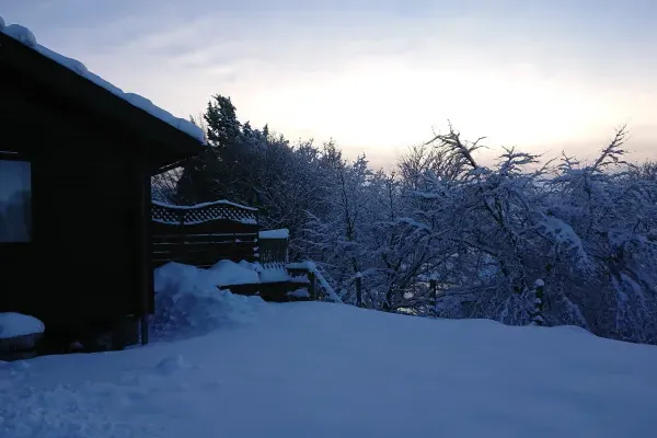 Snow at private lodge with hot tub