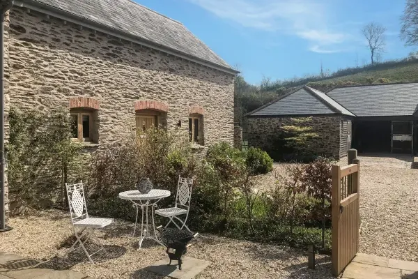 The Cowshed with patio table and chairs